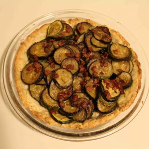 Zucchini tart with bacon is a fun French side dish!
