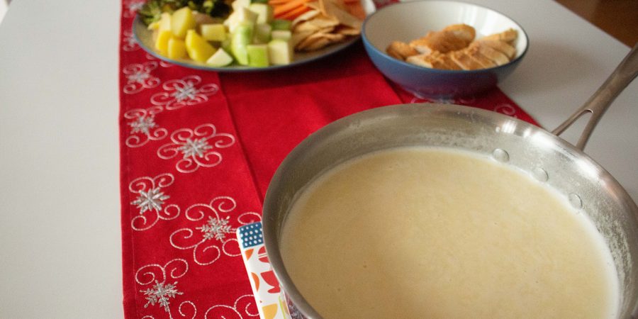 Cheese fondue is the perfect addition to your New Year's Eve party! It makes any gathering feel like a party, and this classic version is effortless to whip up!