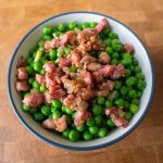 Peas with pancetta are the perfect easy side dish! The pancetta makes them seem elegant, but they're simple enough to toss together in ten minutes!