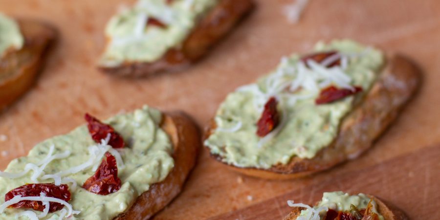 These creamy pesto and tomato crostini will give you the brightness of summer even in the middle of winter!
