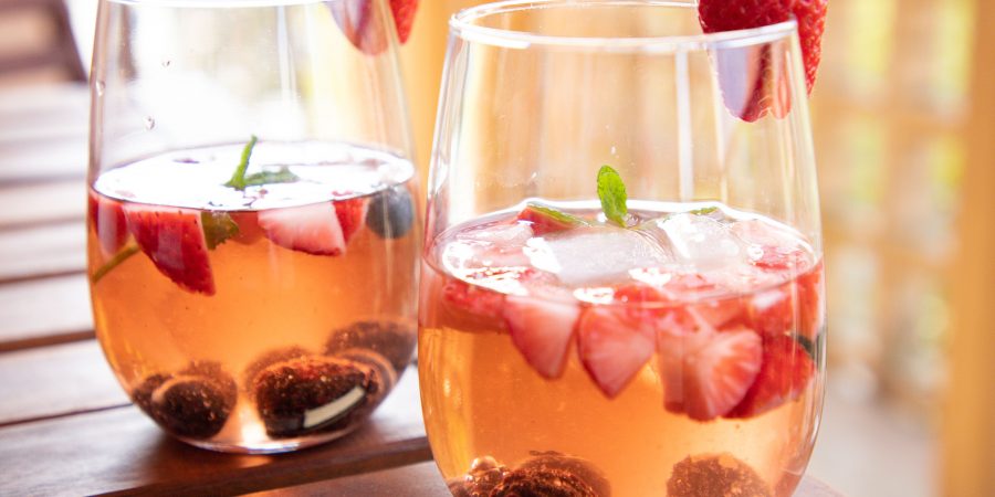 Berry rosé sangria is the perfect picnic sip! It's perfect to take on a day trip to the lake or the park, or just for a summer evening! | Teaspoon of Nose